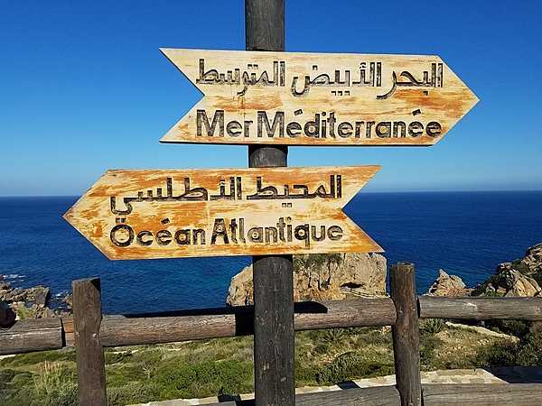 The Atlantic Ocean and the Mediterranean Sea meet at Tangier, Morocco.  For the first half of the 20th century Tangier was an international city with its own laws and administration; it was returned to Morocco in 1956.