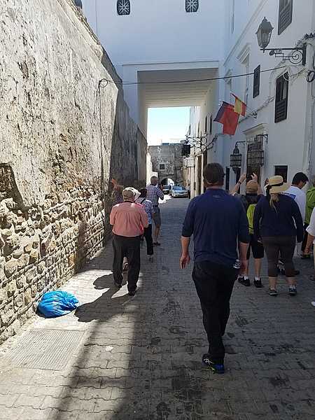 Narrow street in Tangier leading from the Kasbah.   In Morocco, the Arabic word "kasbah" refers to multiple buildings in a keep, a citadel, or several structures behind a defensive wall.