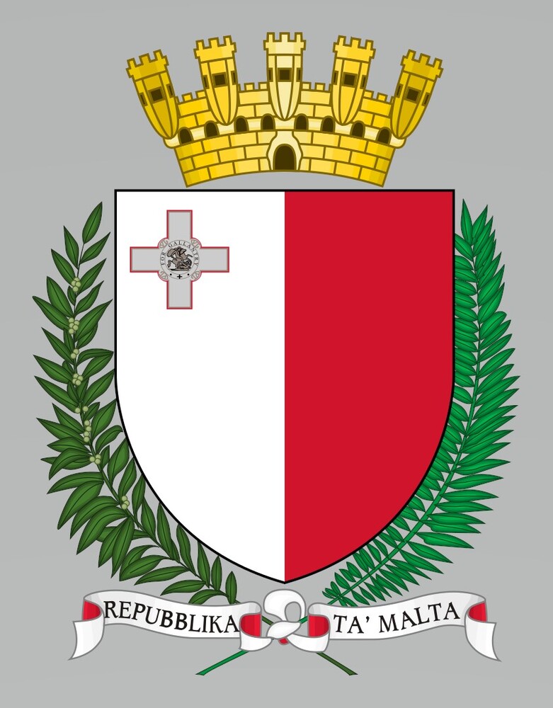 Adopted in 1988, Malta’s coat of arms has a shield displaying the national flag, with olive and palm branches on each side symbolizing peace. On top of the shield is a golden crown in the shape of a fortification with five turrets, representing Malta's forts. The white ribbon below the shield displays the name Repubblika ta' Malta (Republic of Malta).