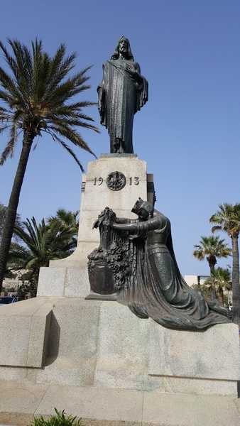 This bronze statue by Antonio Sciortino, located outside the entrance to the capital city of Valletta, was unveiled on 30 December 1917. It commemorates the 24th International Eucharistic Congress, the last of its type, led by Pope Pius X’s representative Domenico Ferrata, and attended by four Cardinals and 53 bishops. This modern contemporary style sculpture portrays an allegorical Malta kneeling and praying at the feet of Christ.