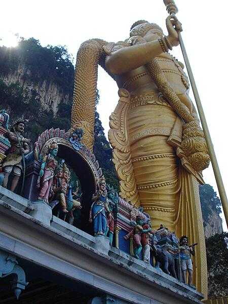 The statue of Lord Murugan at the Batu Caves. Constructed of tons of concrete, steel reinforcing bars, and gold paint, the monument - unveiled in 2006 - took three years to complete. In Hindu mythology, Lord Murugan was a Hindu deity created by Lord Siva to defeat the demon Surapadman.
