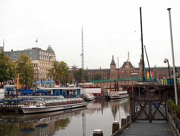 The Amsterdam Centraal railway station overlooks the city&apos;s harbor.