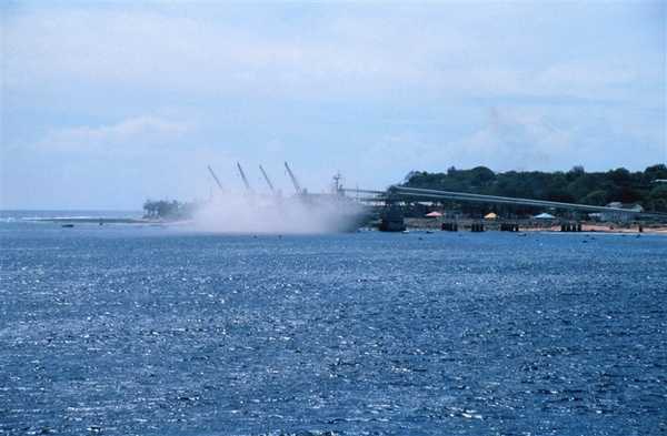 A view of the filling of a bulk carrier ship with phosphate at the piers at Nauru in 1999. Photo courtesy of NOAA / Mark Boland.