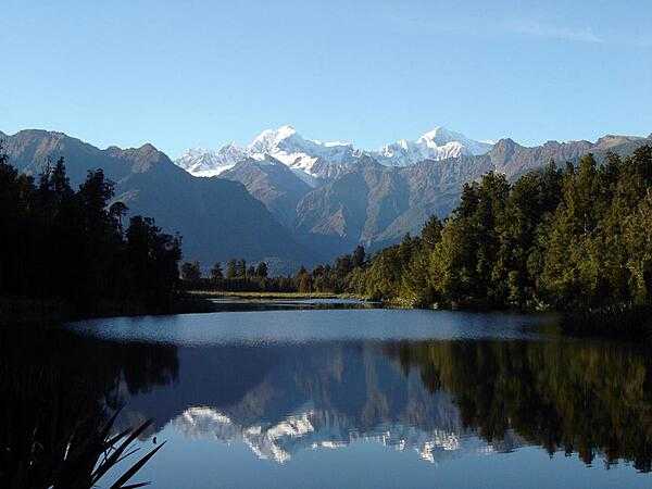 Lake Matheson, on the South Island, is a mirror in the early morning light.