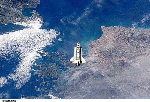 The Space Shuttle Endeavour approaches the International Space Station during rendezvous and docking operations. The spacecraft floats over Cook Strait, the body of water separating New Zealand&apos;s North Island (on the left) from South Island (to the right). Click on photo to increase resolution. Image courtesy of NASA.