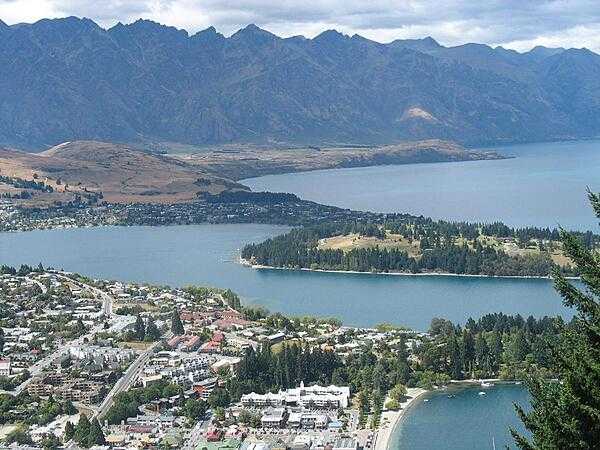 The resort town of Queenstown on South Island is known for its adventure and ski tourism. This photo was taken from one of the hills surrounding the town, looking southeast across the harbor. Queenstown is situated at one of the turns in a Z-shaped mountain lake - Lake Wakatipu - which was formed by glacial processes.