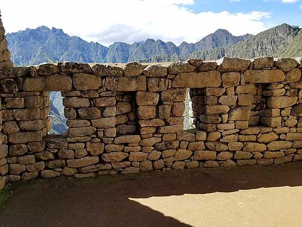 Wall with trapezoidal windows in Machu Picchu.
