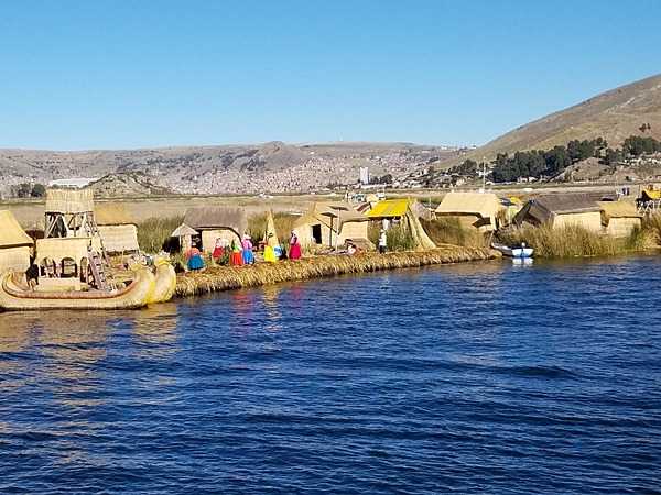 Lake Titicaca on the Peru-Bolivia border is the highest navigable lake in the world at 3,805 m. The lake has floating islands made from totora reed layers that are replenished constantly.