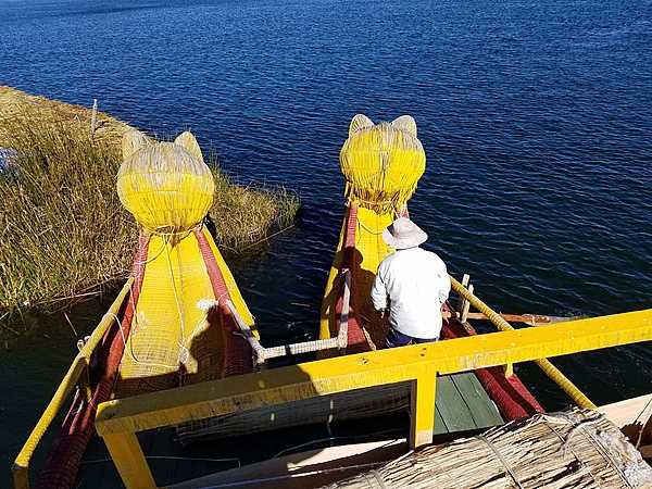 Colorful reed boats with viewing platforms take visitors on tours of Lake Titicaca.