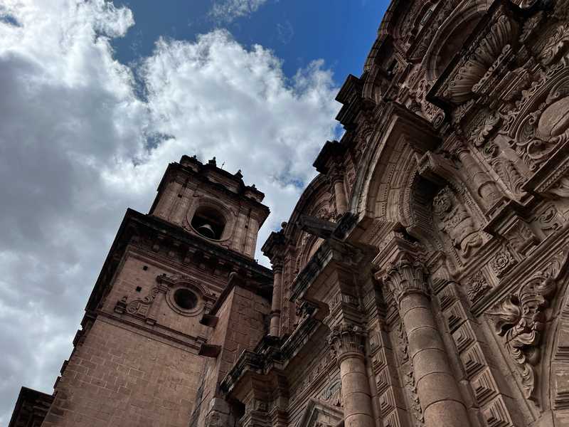 Part of the facade of the Iglesia de la Compañía de Jesús (Church of the Society of Jesus) in Cusco's Plaza de Armas, the city center. Built atop an Inca palace, it is one of the best examples of Spanish Baroque architecture in Peru and its design greatly influenced the development of Baroque architecture in the South Andes. Begun in 1576, the church was badly damaged in an earthquake in 1650; its rebuilding was completed in 1673.