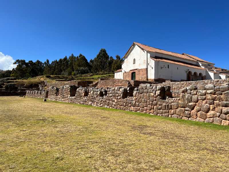 When the Spanish arrived in today's Chinchero in the 1500s, they constructed a church in the Incan main square.  The stone wall was constructed by the Inca with no mortar, but the stones fit snugly together with no space between them.