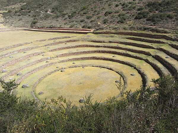 This huge series of concentric terraces in Moray (just west of the salt pans of Maras) may well have served as an ancient agricultural research station. The distance from the highest to lowest ring is 150 m (490 ft), which allowed the Wari and later the Inca peoples to experiment with growing crops at different altitudes and exposure to the sun. The circular bottom is so well drained that it never completely floods, no matter how hard the rain.