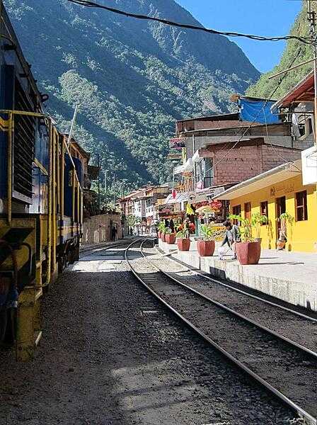A train passing through the center of Aguas Calientes.