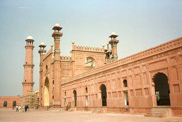 The entrance to the Badshahi Mosque, or “imperial mosque,” as viewed from the mosque courtyard. Built by the Emperor Aurangzeb between 1671 and 1673, it remains the largest mosque of the Mughal period; its courtyard can accommodate 100,000 worshipers. The gateway leads out to the garden known as Hazuri Bagh, beyond which is the Alamgiri gate of the Lahore Fort.