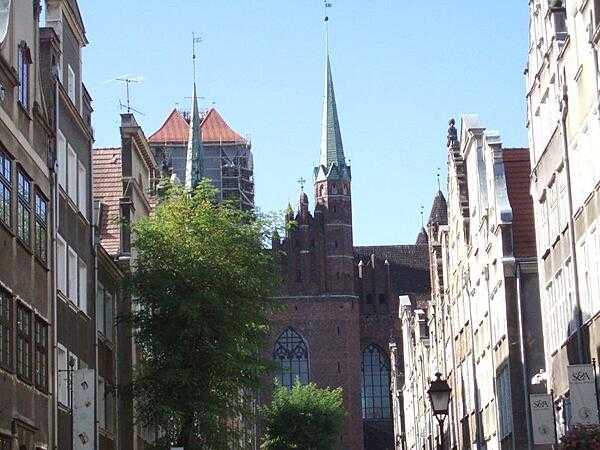 Saint Mary&apos;s Church in Gdansk as seen from Mariacka (Saint Mary&apos;s Gate). Saint Mary&apos;s, built between 1343 and 1502, is the largest brick church in the world and can hold 25,000 people.