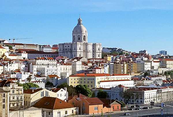Lisbon, Portugal's capital and largest city, is often called the “White City" due to the ochre stone used in its buildings that seems to illuminate the city when the sun’s rays reflect off it. At the center of this picture is the Church of Santa Engracia, a 17th-century monument. Originally a church, it was converted in the 20th century into a National Pantheon in which important Portuguese personalities are buried.