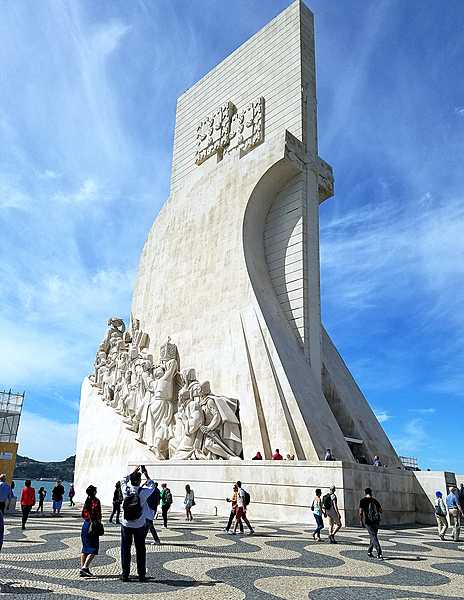 The Padrao dos descobrimentos (Monument to the Discoveries) in Lisbon honors monarchs, explorers, navigators, cartographers, scientists, and missionaries from the Age of Discovery (15th and 16th centuries). The main statue of Prince Henry the Navigator (1394-1460), holding a model of a carrack (a three- or four-masted sailing ship), leads a procession of 32 figures (16 on either side ramp) on the monument. This view is of the east side.