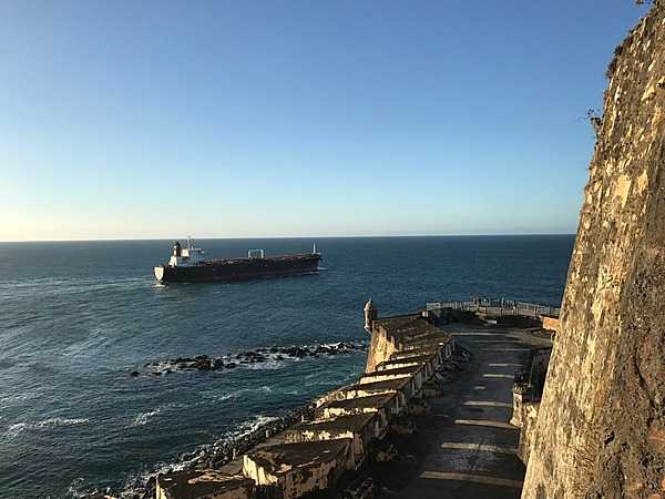 A ship crossing the entrance to San Juan Bay. From the 1500s to today, all ships entering or exiting the bay must pass in front of the mighty walls of the Castillo San Felipe del Morro. Photo courtesy of the US National Park Service/ Casey Ogden.
