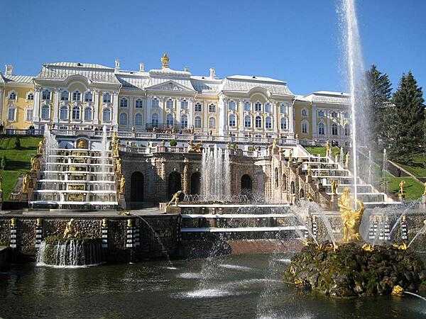Peterhof Palace, near Saint Petersburg, sits atop a hill overlooking the Gulf of Finland. The Palace boasts a remarkable array of 64 decorative fountains, including a spectacular sculpture of Samson prying open the jaws of a lion as water cascades down terraced steps in the background. This was Peter I&apos;s summer palace.