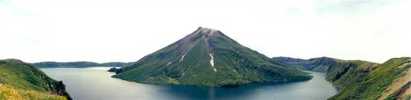 A volcano in the Kuril Islands. This volcano appears to have been formed after a volcanic collapse forming a caldera, similar to Wizard Island in Crater Lake, Oregon. Photo courtesy of NOAA / Anatoly Gruzevich.