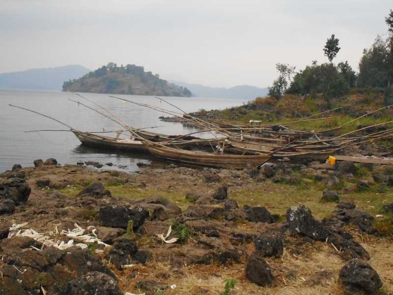 A view of fishing boats on Lake Burera, a twin lake with Lake Ruhondo, both of which are located in Rwanda’s northern region near Volcanoes National Park. The two lakes were created by volcanic activity from Mount Muhabura, whose lava blocked the flow of the Nyabarongo River, forming twin lakes separated by a 1-km-wide strip of land. The island of Cyuza appears on the background.