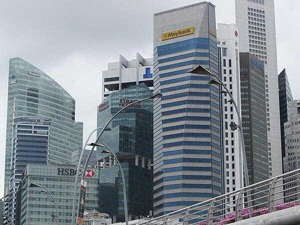 Skyline of the Singapore business district. Singapore is one of the world&apos;s leading financial centers.