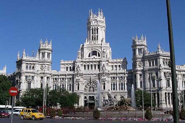 The eclectic Palacio de Comunicaciones (Palace of Communications) in Madrid successfully combines elements of Gothic, Romanesque, and Renaissance architecture. Opened as the headqusrters for the Post and Telegraph State Company in 1909, it became the municipal headquarters of Madrid in 2007.