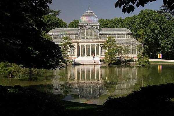 The Palacio de Cristal (Crystal Palace) in the Parque del Buen Retiro (Park of the Pleasant Retreat) in Madrid. Inspired by The Crystal Palace in London, it was built of glass and steel in 1887 - originally to keep alive exotic plants from the Philippines.