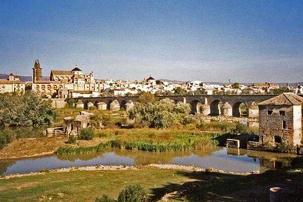 View of Cordoba showing the Roman Bridge and the massive Mesquita complex on the left.