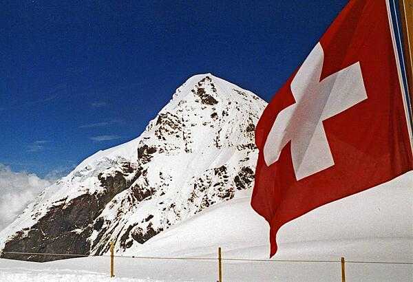 The Swiss flag against a field of snow.