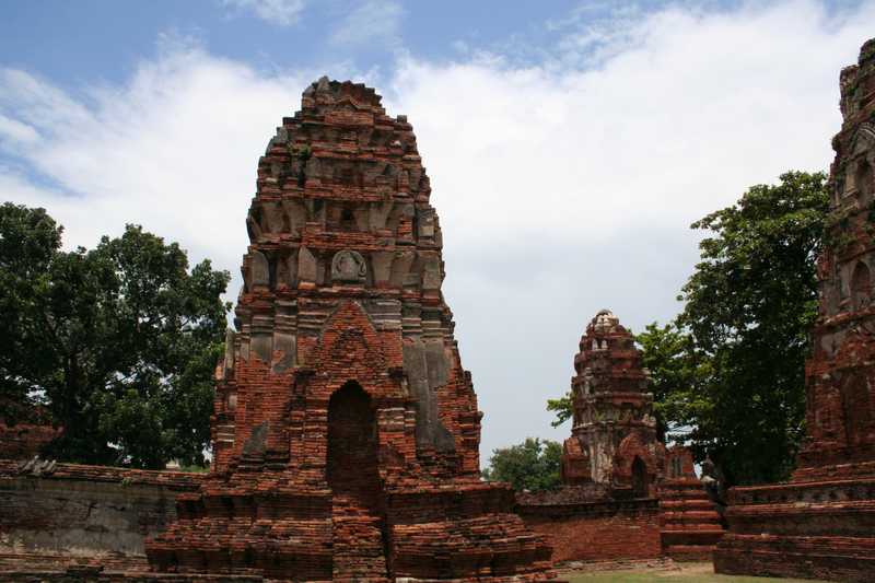 Chedis at Ayutthaya.  Ayutthaya was the second capital of the Kingdom of Siam.  Founded in 1350, Ayutthaya expanded to become one of the world's largest and most cosmopolitan urban areas and center of trade.