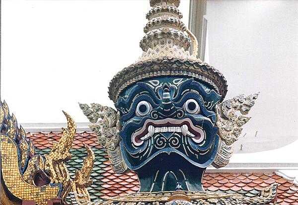 Head of a mythological giant at one of the exits at the Grand Palace in Bangkok.
