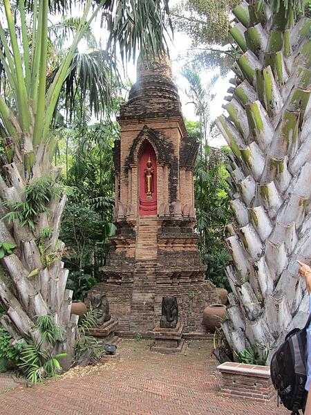 Shrine on a pathway in the Garden of Serenity at the Prasart Museum in Bangkok.