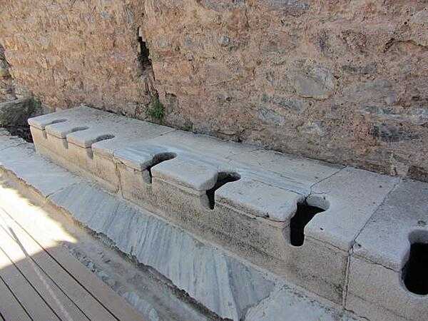 The public toilets in Ephesus were located in the public baths and had running water. Servants were often employed as seat warmers before the patrons used the cold stone seats. An inscription on a wall reads: &quot;Close your eyes, count slowly to 10, and it will come.&quot;