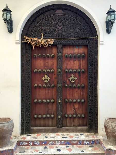 An example of the carved wooden doors in the historic Stone Town section of Zanzibar. The doors served not just as security barriers for a home, but also as designators of the inhabitants' business, religion, and cultural heritage. Stone Town is a UNESCO World Heritage Site.