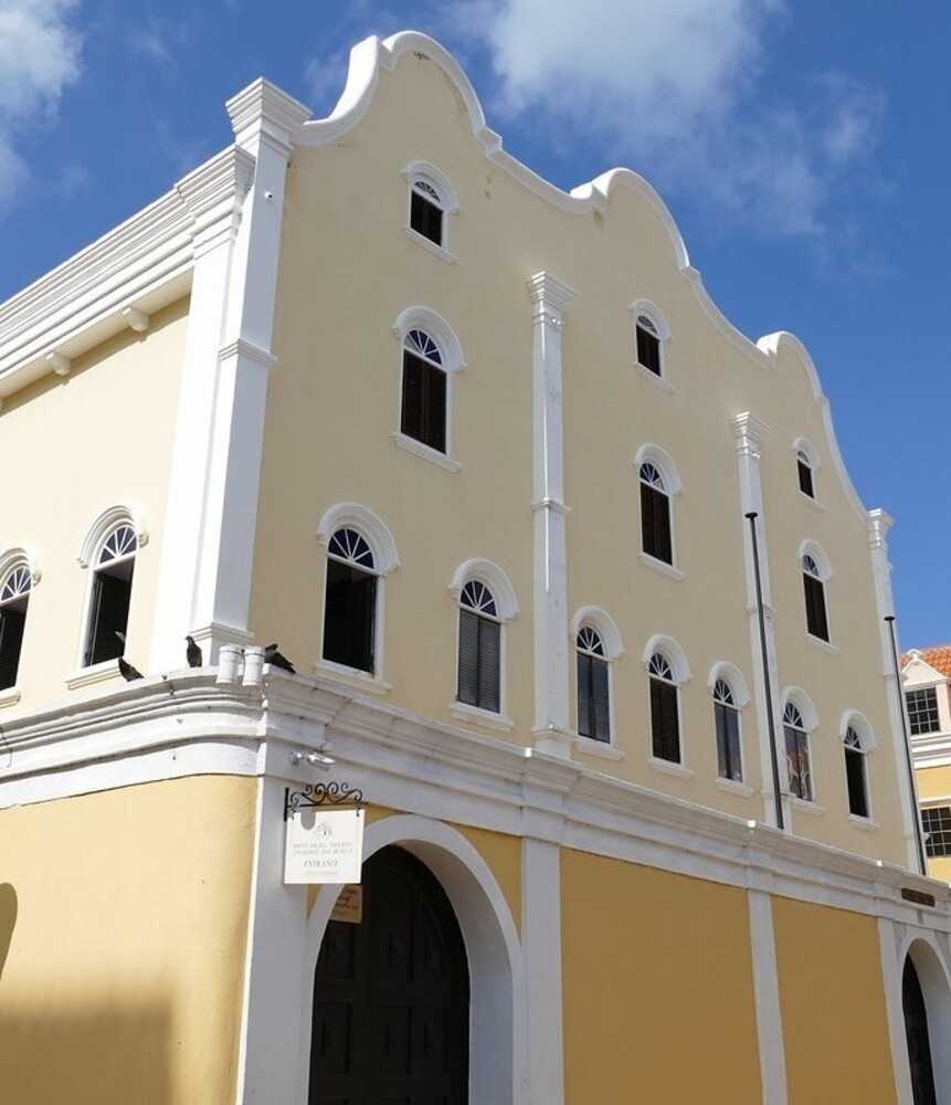 Spanish and Portuguese Jews from the Netherlands and Brazil built the Mikvé Israel-Emanuel (The Hope of Israel-Emanuel) synagogue in Willemstad, Curaçao. Consecrated in 1732, it is the oldest synagogue in continuous use in the Americas. Willemstad was designated a UNESCO World Heritage site in 1997 for its colorful and historical Dutch colonial architecture that includes the synagogue, one of the city’s major tourist sites. 