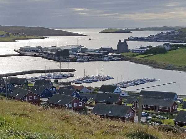 A view of Scalloway, its harbor, and its castle remains (in the middle distance).