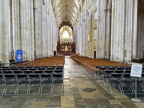 The nave of Winchester Cathedral in Hampshire, England. Construction began in 1079 and the church was consecrated in 1093; additions to the structure took place in subsequent centuries. Winchester Cathedral is one of the largest in Europe and has the greatest overall length (169 m) of any Gothic cathedral.