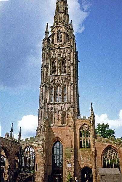 Tower, spire, and part of the outer wall of the old St. Michael&apos;s Coventry Cathedral, England.  Built in the late 14th and early 15th centuries, the church was bombed and almost obliterated during the Blitz in 1940. Today it stands next to the new cathedral and serves as a place of reflection and reconciliation.