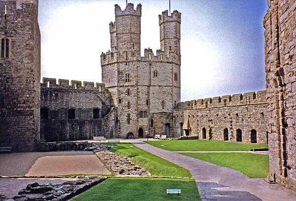 Inside Caernarfon Castle, Wales. The tradition of investing the heir to the throne of Britain with the title Prince of Wales was begun in 1301 when King Edward I invested Prince Edward with the title. Prince Charles was the last heir to be invested there in 1969.