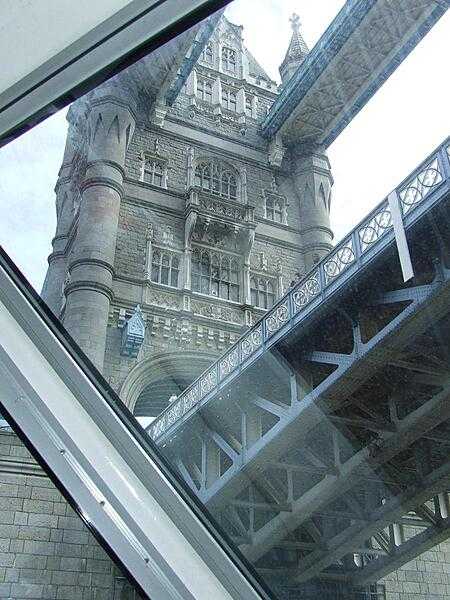 Passing under Tower Bridge as seen through the observation window of a cruise ship.