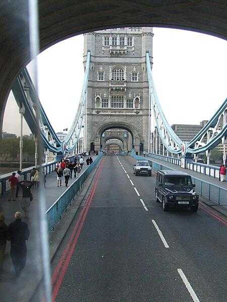 View from out the back of one of London&apos;s famous double-decker buses crossing Tower Bridge.