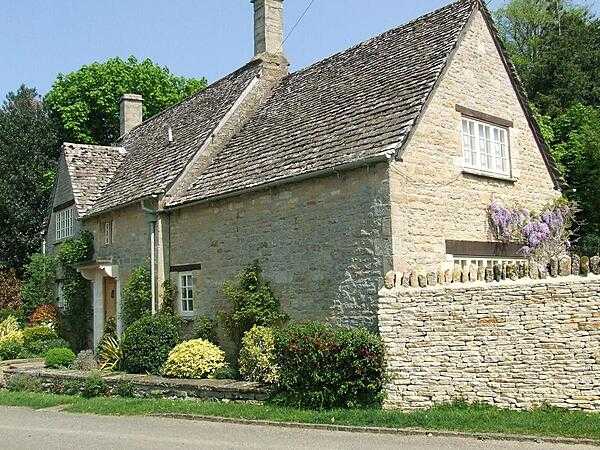 A sturdy Cotswolds house built of locally quarried, distinctive honey-colored limestone.