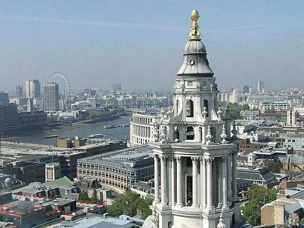 A vista of London from the Golden Gallery, the highest point of the outer dome of St. Paul&apos;s Cathedral in London. Some 85 m (280 ft) above the city, this view requires a climb of 530 steps. The large structure on the right is the cathedral&apos;s west end clock tower.