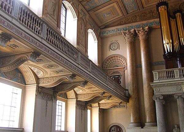A view towards the back of the Chapel at the Queen Mary Court of the Old Royal Naval College in Greenwich, showing part of the balcony and organ.