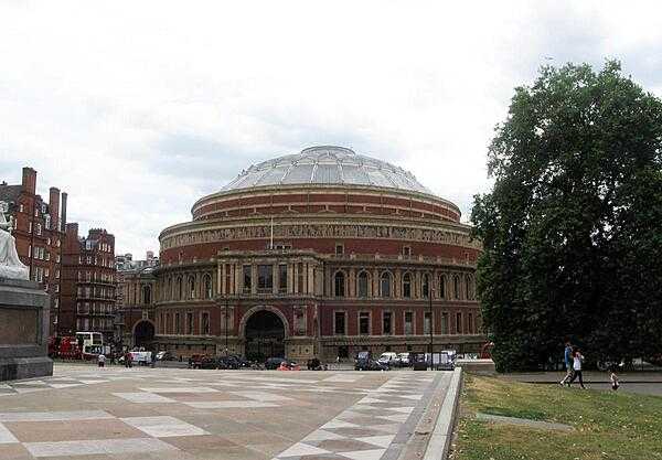 The Royal Albert Hall in London, England as seen from the Albert Memorial looking across Kensington Gore.