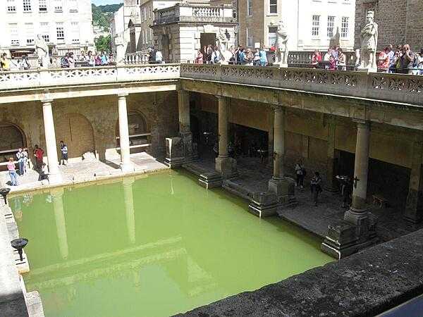 The Great Bath at Aquae Sulis (today Bath) England. Although the water from the hot spring is colorless, it acquires its distinctive green hue from algal growth caused by the heat of the water and from sunlight.
