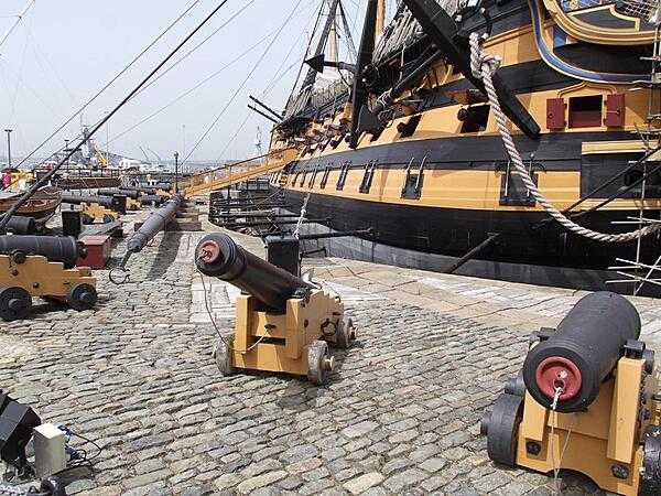 A view of the starboard side of HMS Victory, Lord Nelson&apos;s flagship from the Battle of Trafalgar, in drydock at the historic dockyards area of Portsmouth Harbor, England. She is the world&apos;s oldest naval ship still in commission and carries 104 guns.