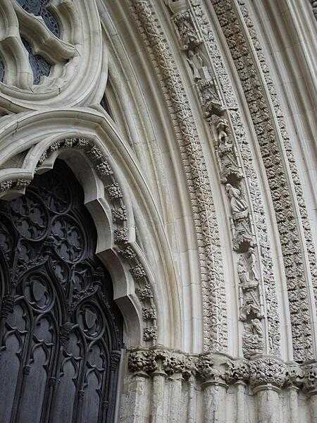A close up of one of the York Minster entrances highlighting some of the replacement carvings installed as part of the restoration effort.