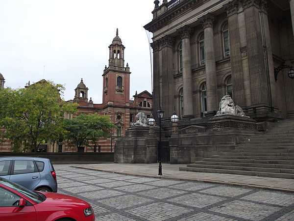 At the front entrance to Leeds Town Hall; in the background is Oxford Place Centre.